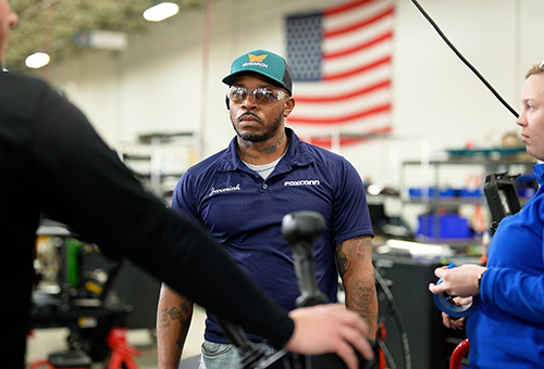 Electric tractor production team member in the USA.